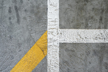 Fototapeta premium Concrete texture with yellow painted line. Background graphic asset.