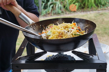Cooking asian food in a wok pan