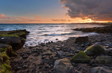 Fototapeta na wymiar rocks and sea in sunset time