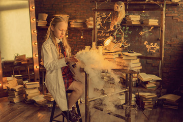 small researcher with test tubes in laboratory
