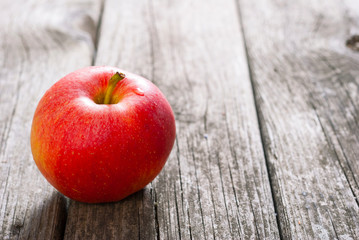 apple on old wood table