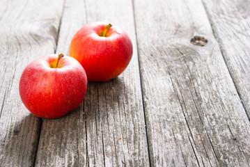 two apples on old wood table