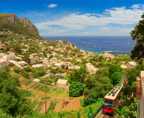Aerial view of rocky coast and Marina Grande, Capri island, Italy. A panorama view from Piazzo Umberto over Marina Grande and the funicular railway on the island of Capri, Europe.
