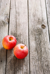 two apples on old wood table