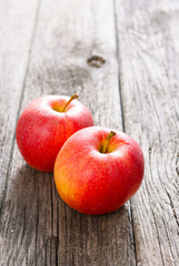 two apples on old wood table