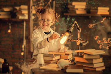 small girl working in the class with reagents