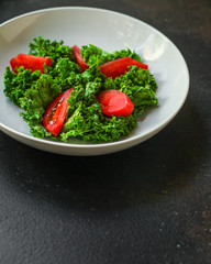 Healthy salad, tomato, leaves mix salad (mix micro greens, juicy snack). food background