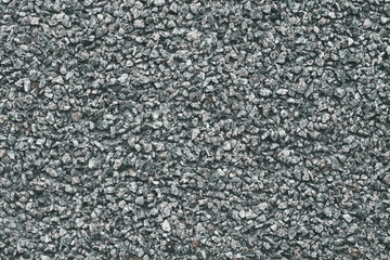 Grey stone background. Abstract pattern of gravel. Natural road texture. Rock material. Grunge floor on street.
