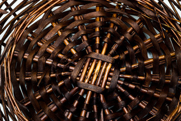The structure and background of the wicker basket. Pattern round texture. Vertical and horizontal weave.