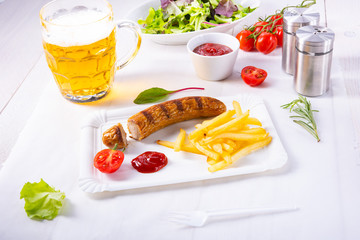 delicious bratwurst with rolls and beer