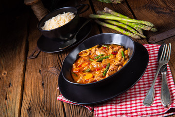 colorful turkey fricassee with asparagus and paprika