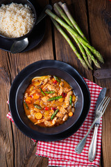 colorful turkey fricassee with asparagus and paprika
