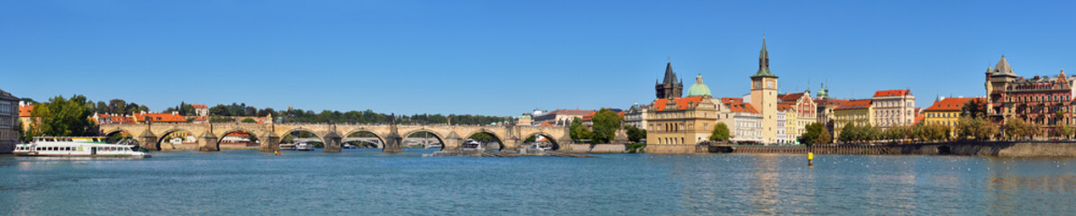 Fototapeta na wymiar Autumn panorama of Charles Bridge and riverside in Prague