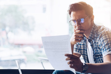 Facing failure. Male freelancer looking for a remote job. Copy space on the left side