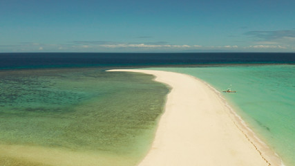 Beautiful beach on tropical island surrounded by coral reef, sandy bar, top view. Sandbar Atoll. Summer and travel vacation concept, Camiguin, Philippines.