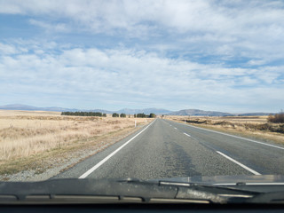 View from the car, Southern Alps mountain range on the road in New Zealand