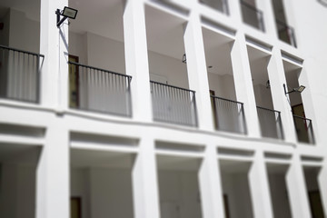 Fototapeta premium Architectural details of white building with blue sky background
