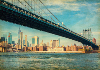 The Manhattan Bridge with Manhattan in the background at the day-time, New York City, United States. Photo in retro style. Added paper texture.