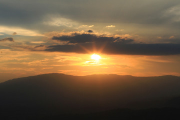 Beautiful landscape layers of mountain and Misty on hill valley in golden twilight of sunset at Thailand