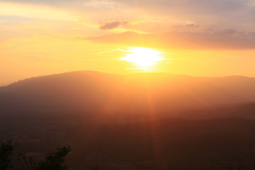 Beautiful landscape layers of mountain and Misty on hill valley in golden twilight of sunset at Thailand