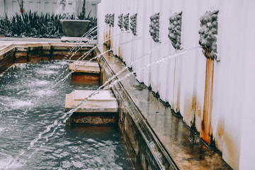 water flowing from lion head sculpture