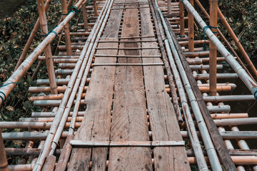 wooden bridge footbridge walkway crossing river
