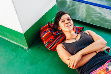 beautiful girl lies on a large public ferry