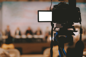 video production camera recording live event on stage. television social media broadcasting seminar...