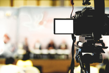 video production camera recording live event on stage. television social media broadcasting seminar...