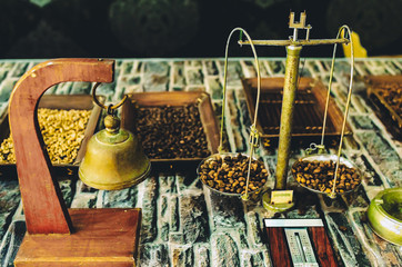 coffee beans on old vintage scales. manual coffee grinder