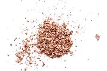 Crushed nude shimmer eye shadow texture isolated on white background. Face powder, bronzer swatch. Broken eye shadow smear. Cosmetic powder sample.