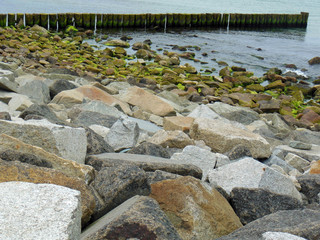 Scenic view of a coast line with pebble stones