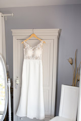perfect wedding dress at home in marriage day on a hanger