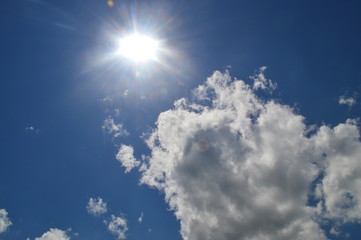 Naklejka na ściany i meble blue sky with clouds and sun