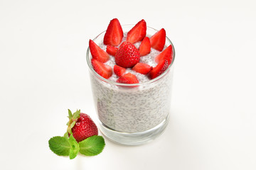 Chia pudding with strawberry and mint on a white background. Space for text or design.