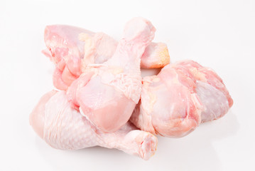 Tasty raw chicken legs. Top view. Isolated on white