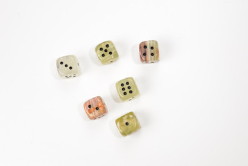 Dices made of natural stone on a white background. Copy space. Gaming.