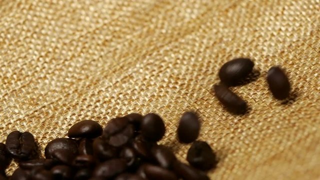 Coffee beans falling slow motion, close-up