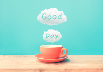 Happy moment with a cup of coffee and good day text on wood bar table background