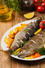 Grilled whole trout. Served with baked potatoes.