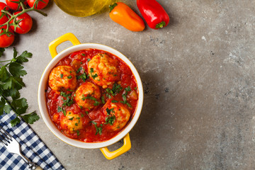 Chicken meatballs with tomato sauce. Served with rice.