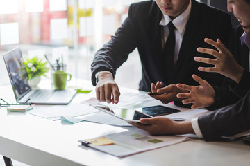 Group new generation of businessman who have succeeded in their work showing financial report in the meeting.