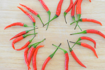 Red peppers are on  background of the wood...