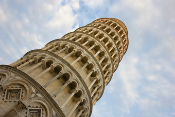 Leaning Tower of Pisa, Italy, with a cloudy sky. The most famous landmark of Italy