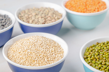 Various legumes in small bowls