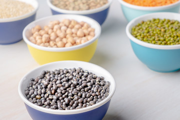 Various legumes in small bowls