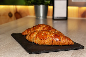 having breakfast with croissant