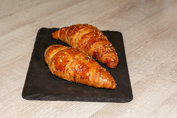 having breakfast with croissant