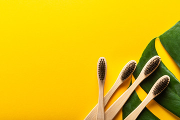 A family set of four wooden bamboo toothbrushes