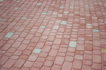 Texture of red floor paving tiles in city - background